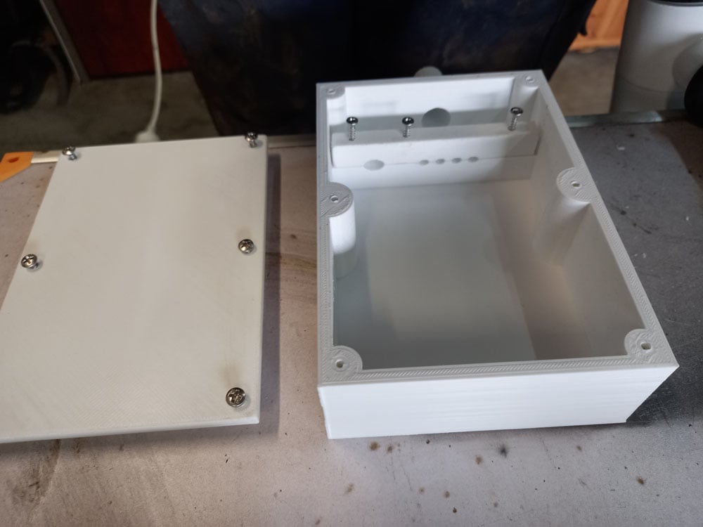 Box with lid and cable clamp