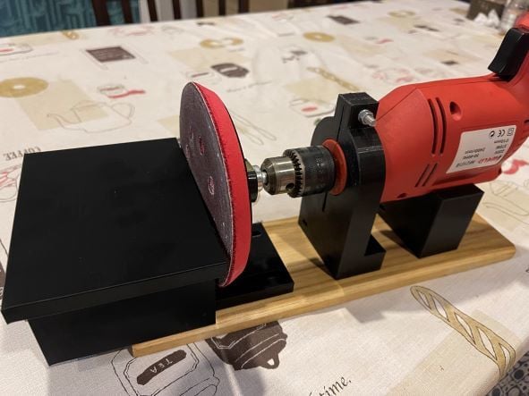 Drill clamp with sanding table attachment