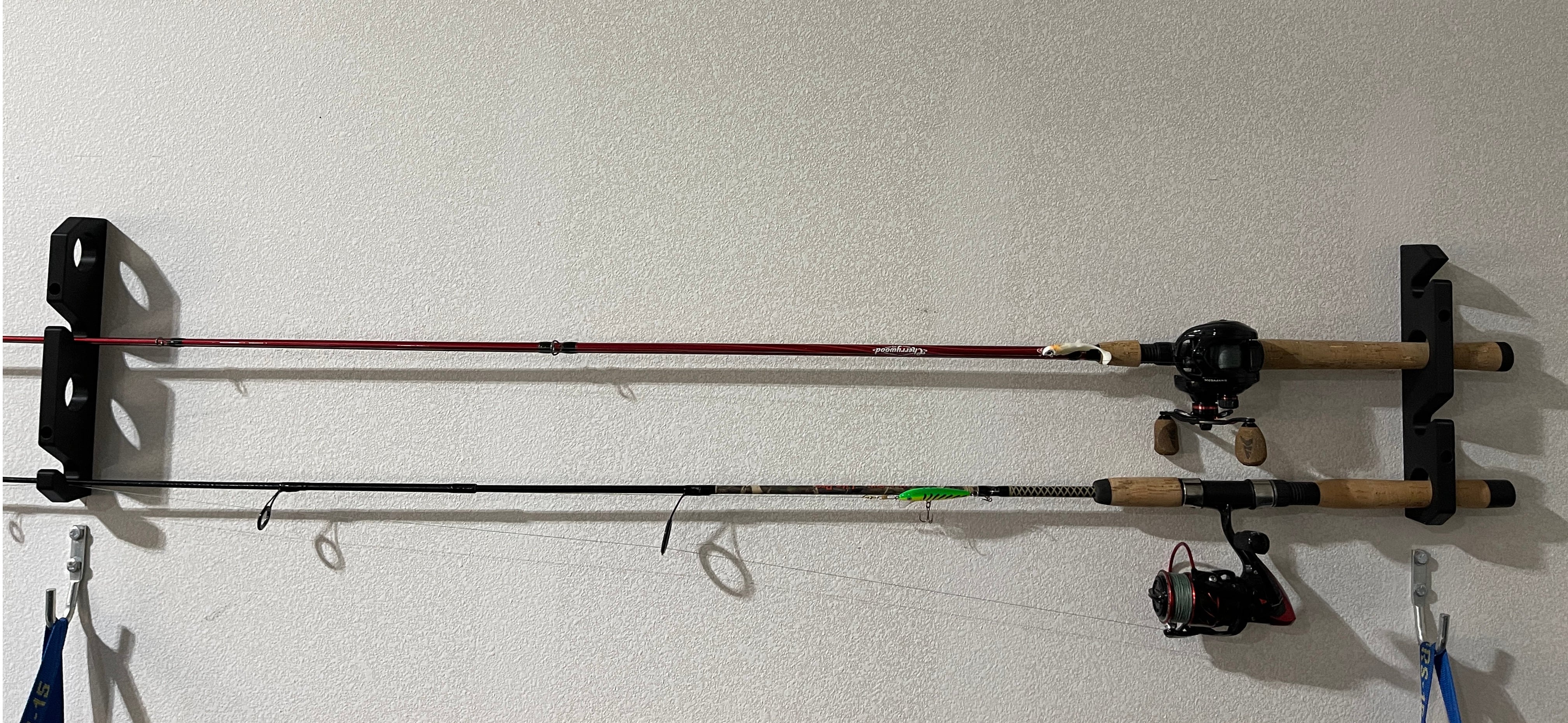 Wall-mounted fishing rod holder