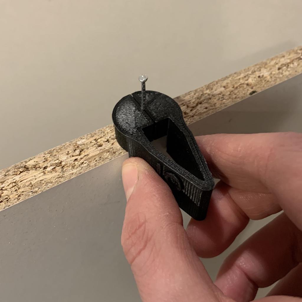 nail holder | useful mounting tool to hold a nail in perfect alignment to nail in a back panel in a furniture