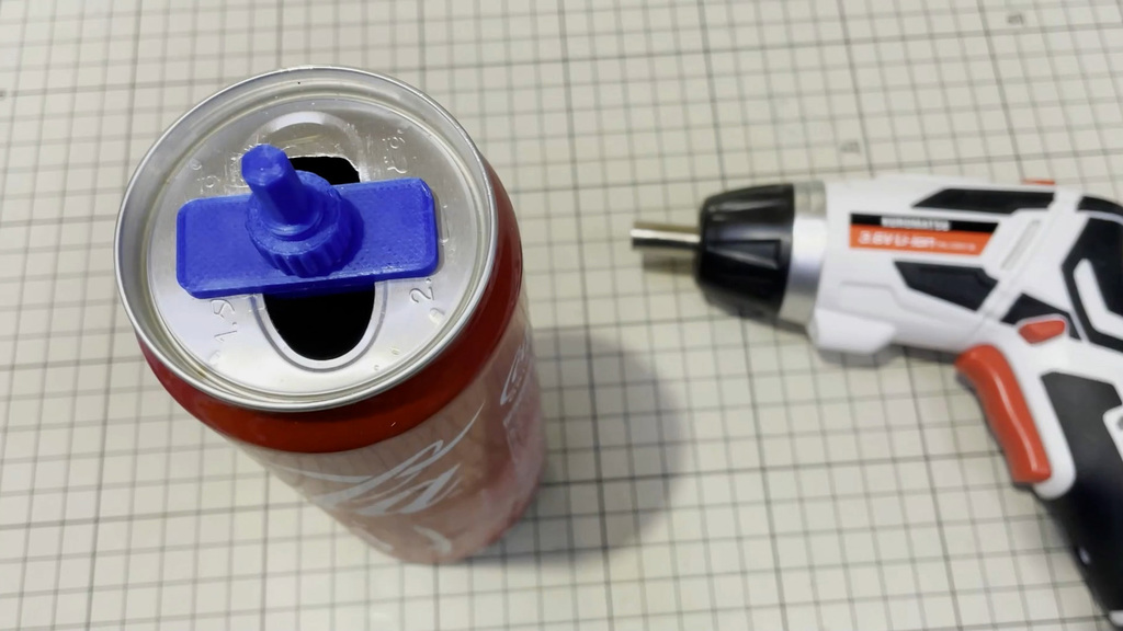Electric drill accessory (fix the top part of a soda can)