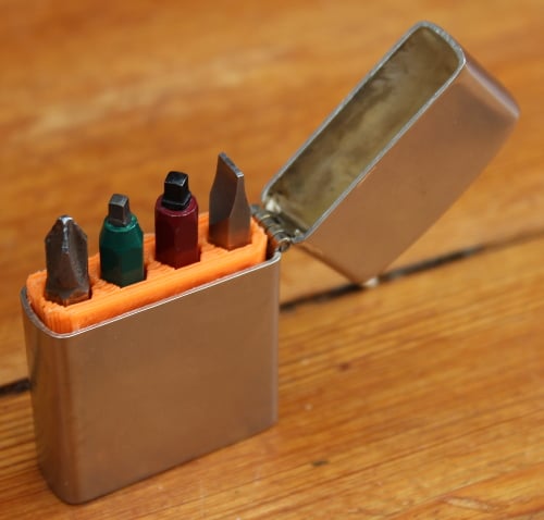 Insert for holding screwdriver bits in a lighter