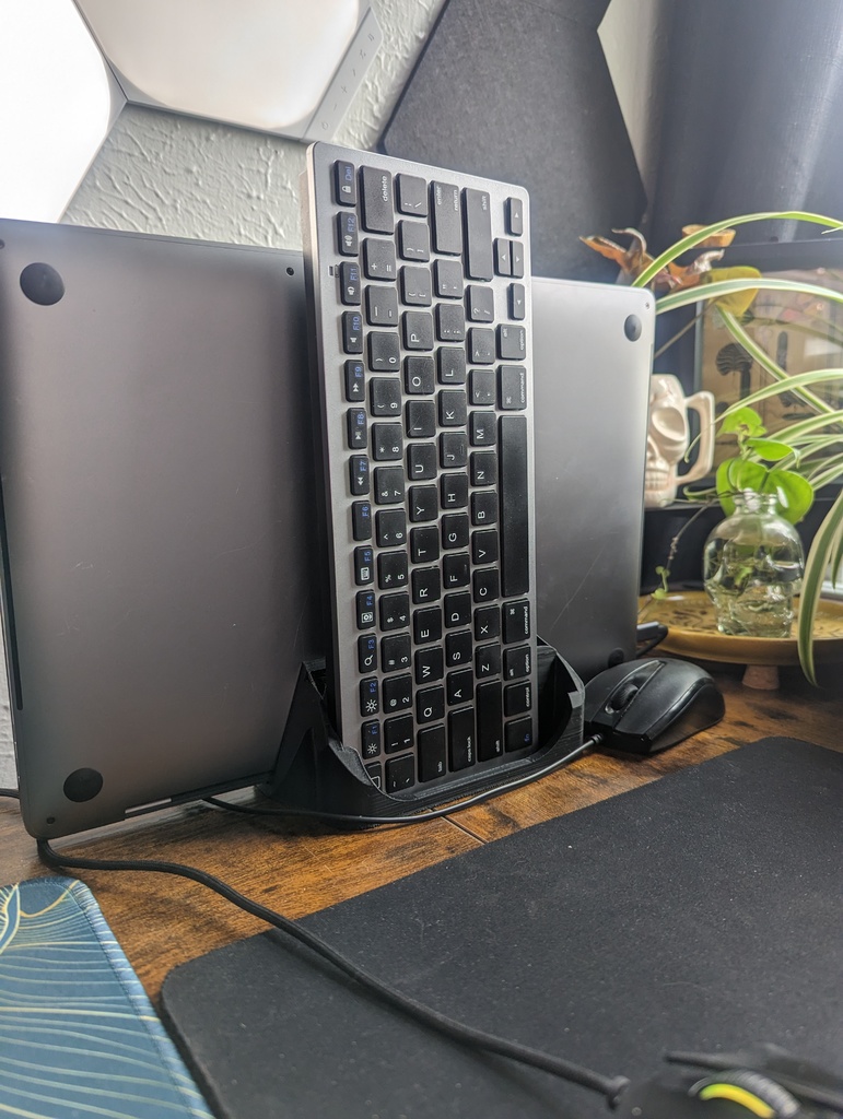 Vertical laptop stand and storage