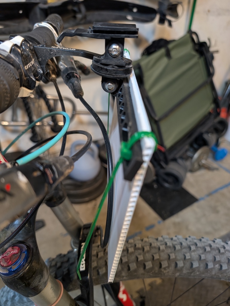 Bicycle race plate holder for a gopro bracket.
