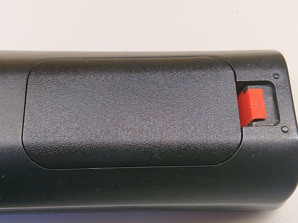 LG remote battery cover catch