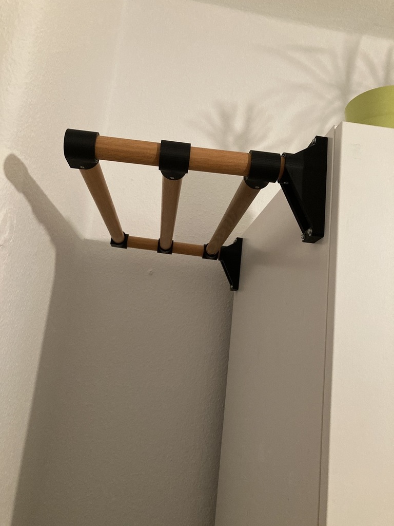 Clothes rail made of a broom handle for side mounting on a wardrobe