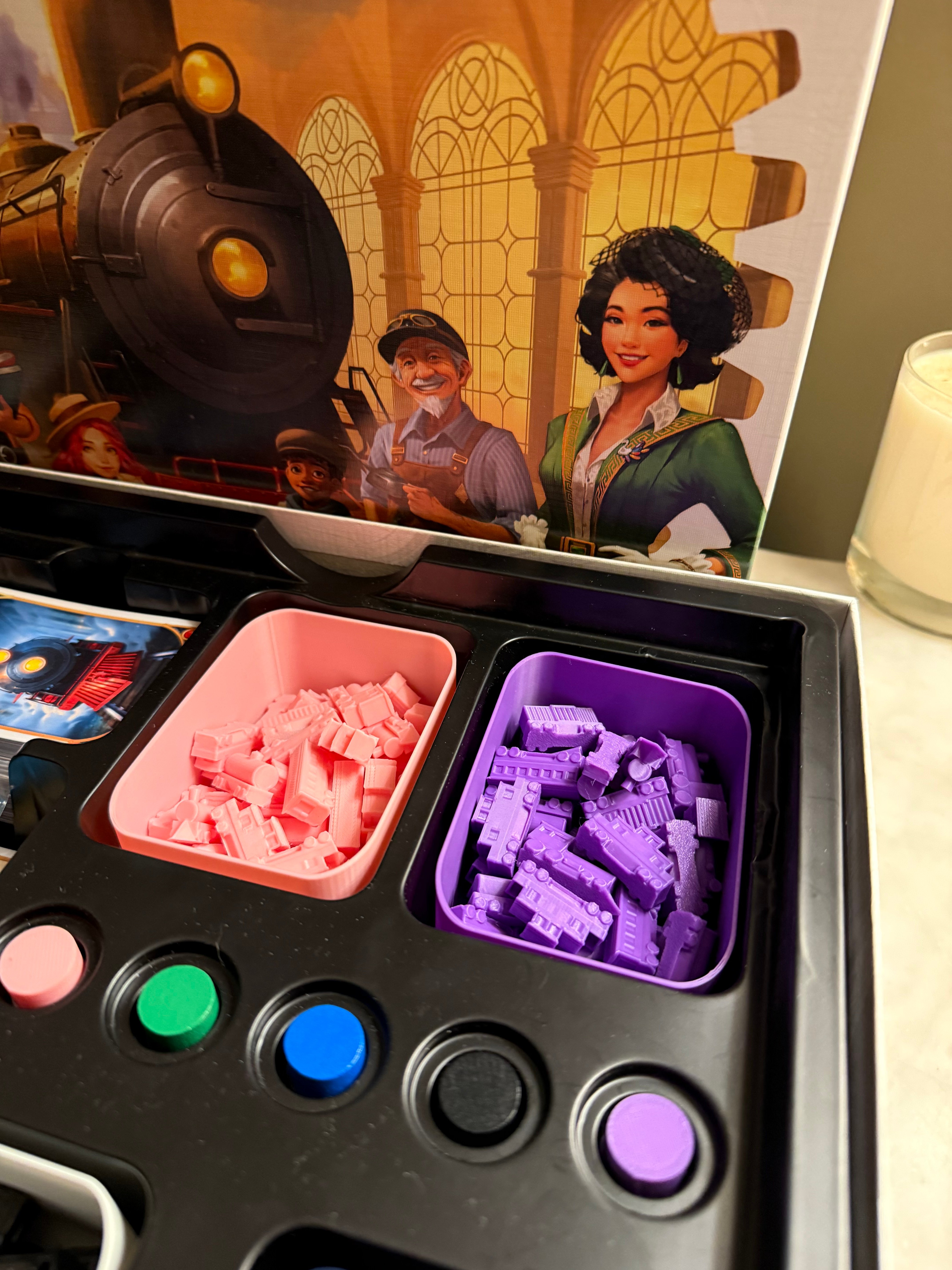 Ticket to Ride (TTR) trains, box, and score token.
