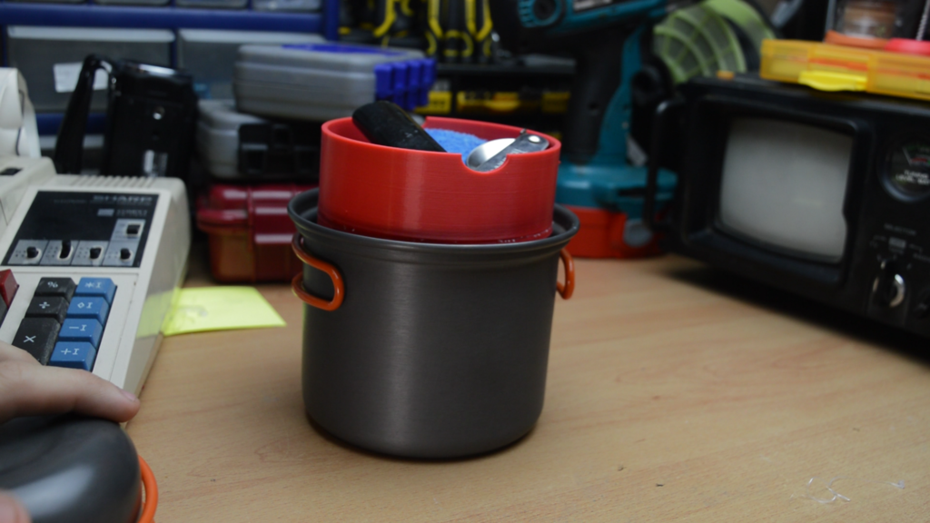 Gas bottle cover and utensil holder for backpacking stove