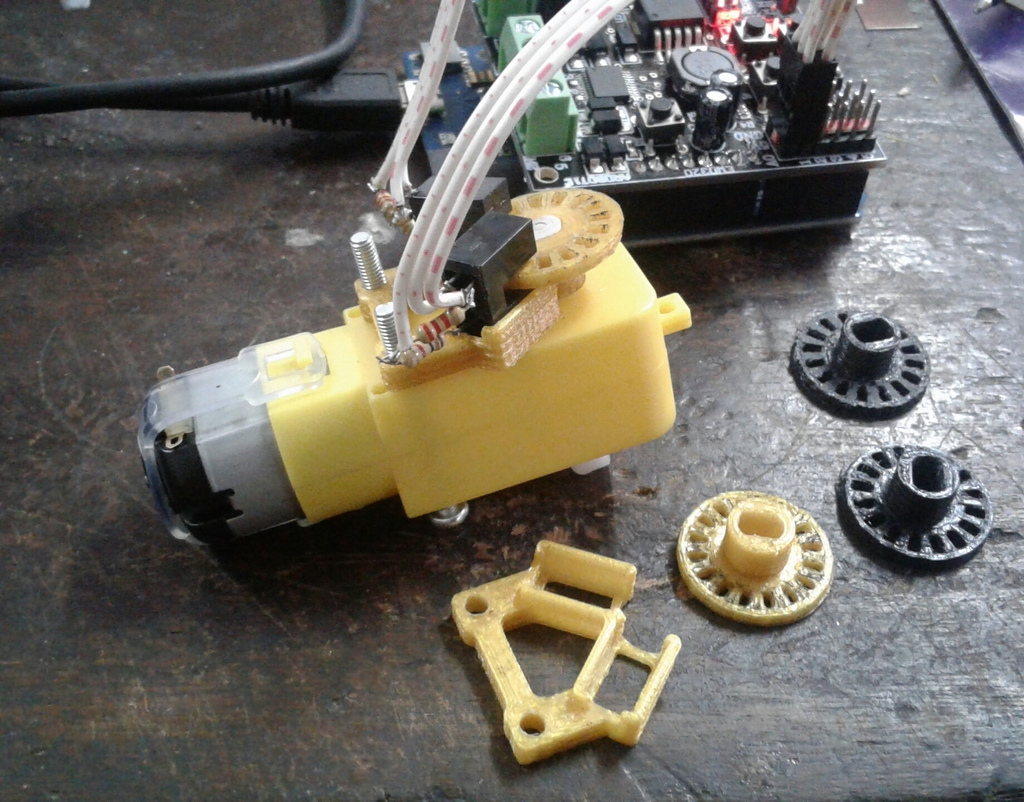 Encoder wheel and photointerrupter holder for yellow dc gear motor