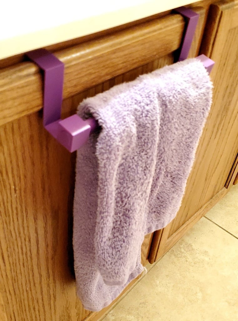 Hand towel rack for cabinet