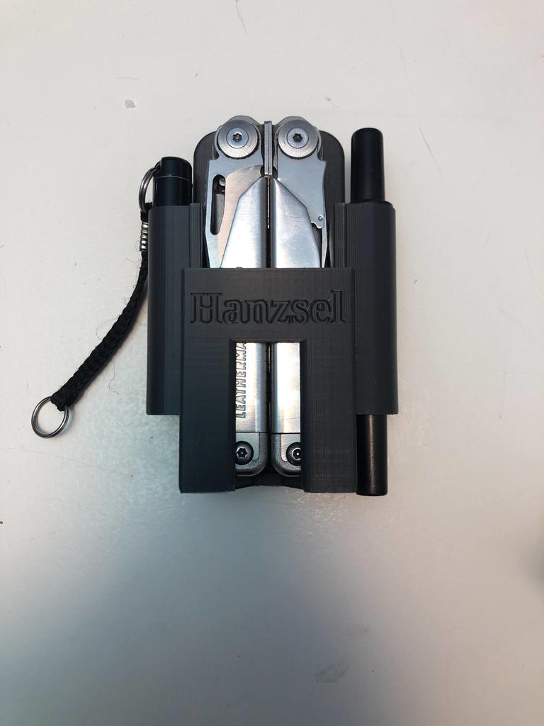 Leatherman Surge with a sharpner holder and holder for the mini maglite