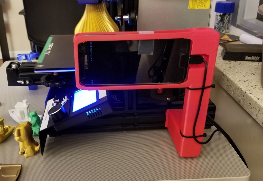 Holder for smart phones up to Samsung S8 to hold phone to record print head on Ender 3.