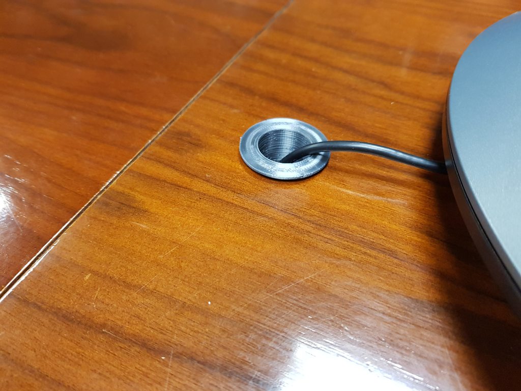 Cable guide for table hole