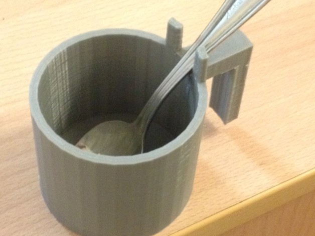 Cup for cold drink with parking for spoon