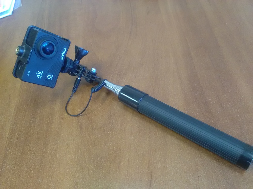 Mount action camera on selfie stick. GoPro compatible.