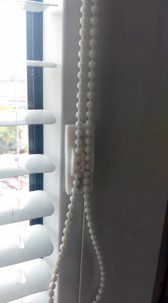 Window blind chain holder