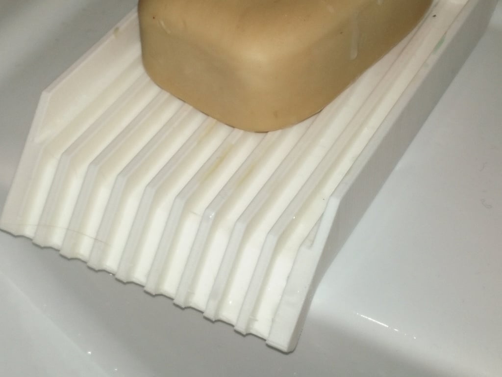 Soap holder with water drain