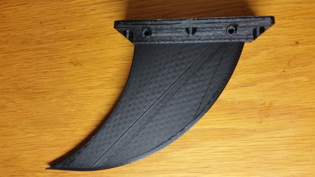 Skeg fin for Deflecting Debris around a hull mounted Bluerobotics T100 or T200 Thruster