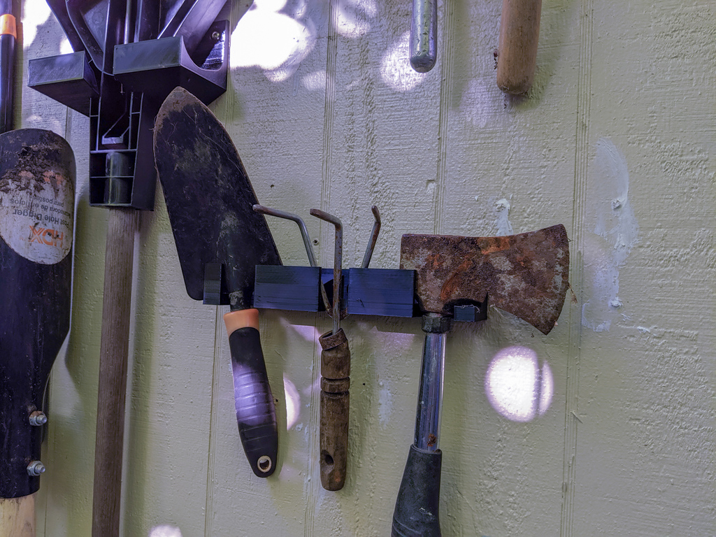 garden tools hangers: shovel, rake, axe, broom, hand tools
