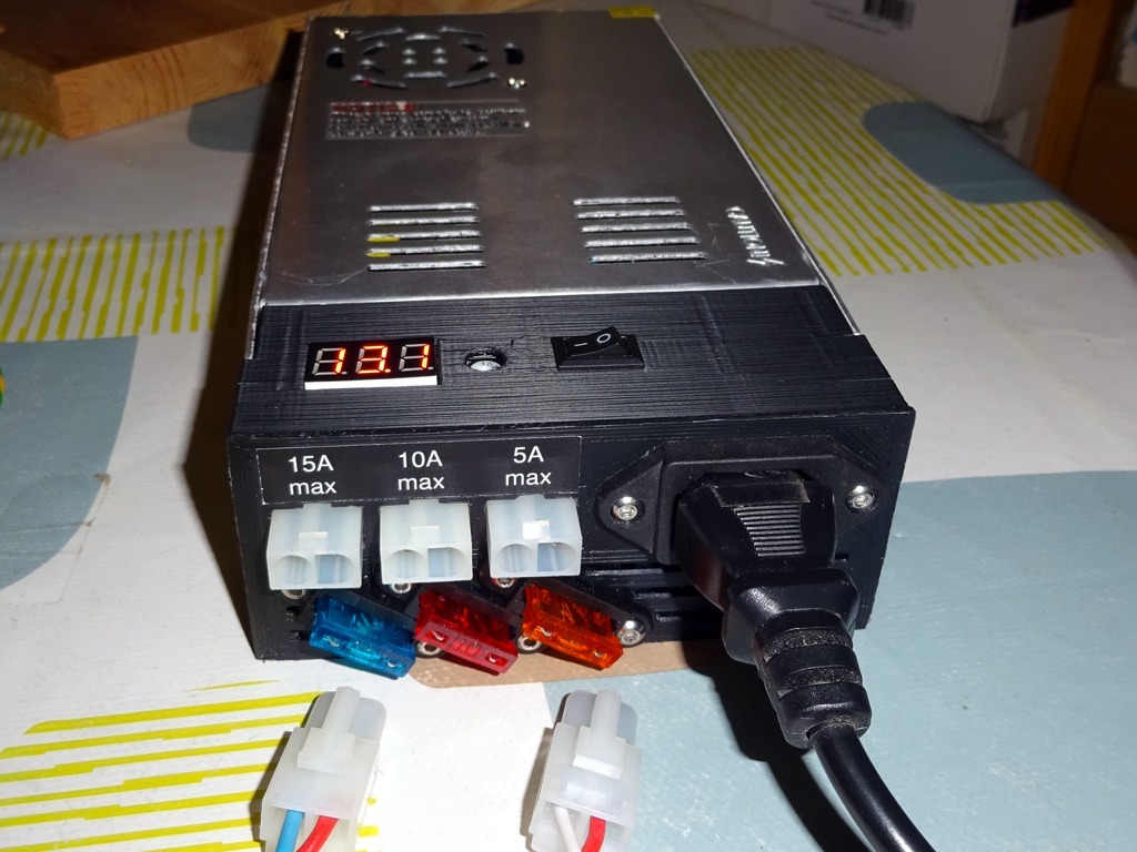 Power supply cover with fused outlets