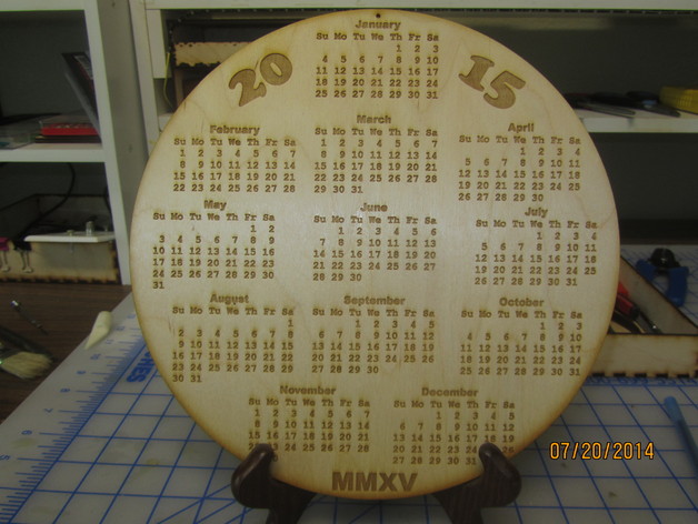 Laser Engraved Calendar.  Laser burned and cut 2015 circle calendar on wood.
