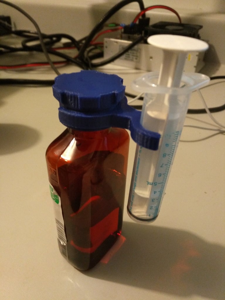 Medical bottle cap and syringe support