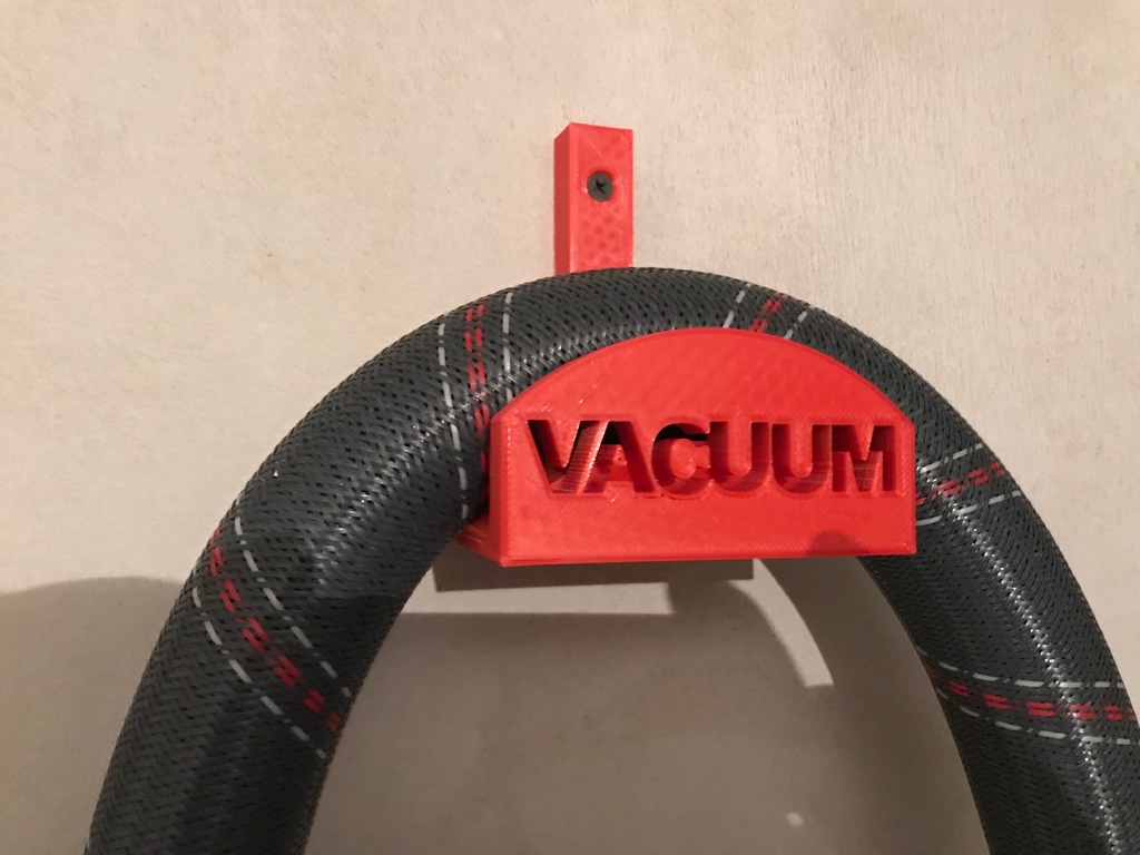 Vacuum hose holder