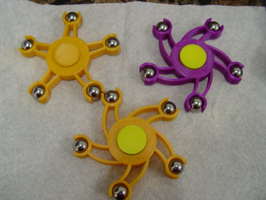 Fidget spinner with 5 spokes and ball bearing weights