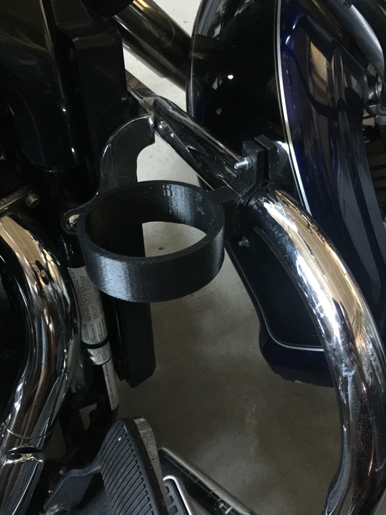 Engine guard mounted cup holder