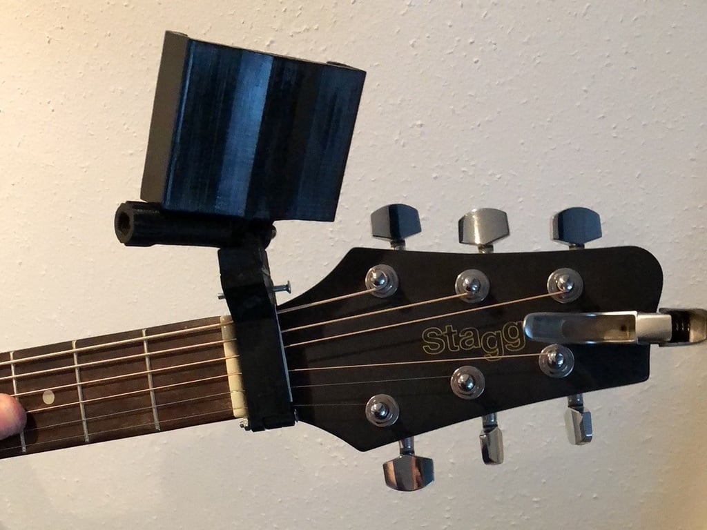 Guitar neck phone holder