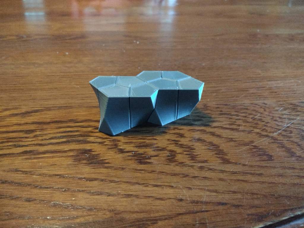 Pentagonal Scutoid that Tiles with Itself