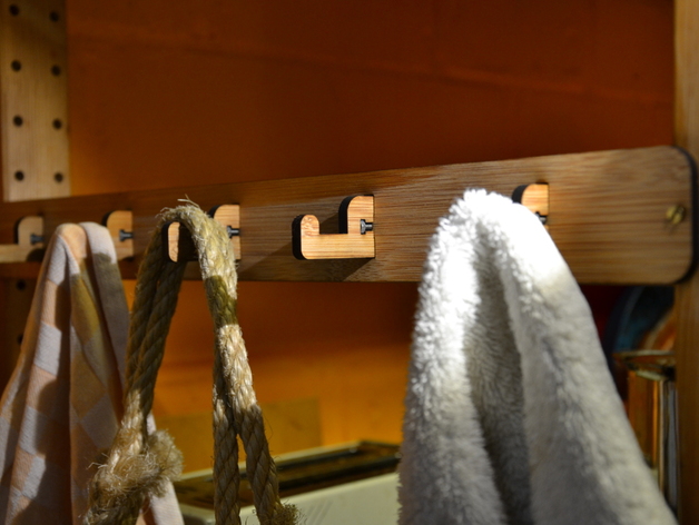 Towel rack with small hooks