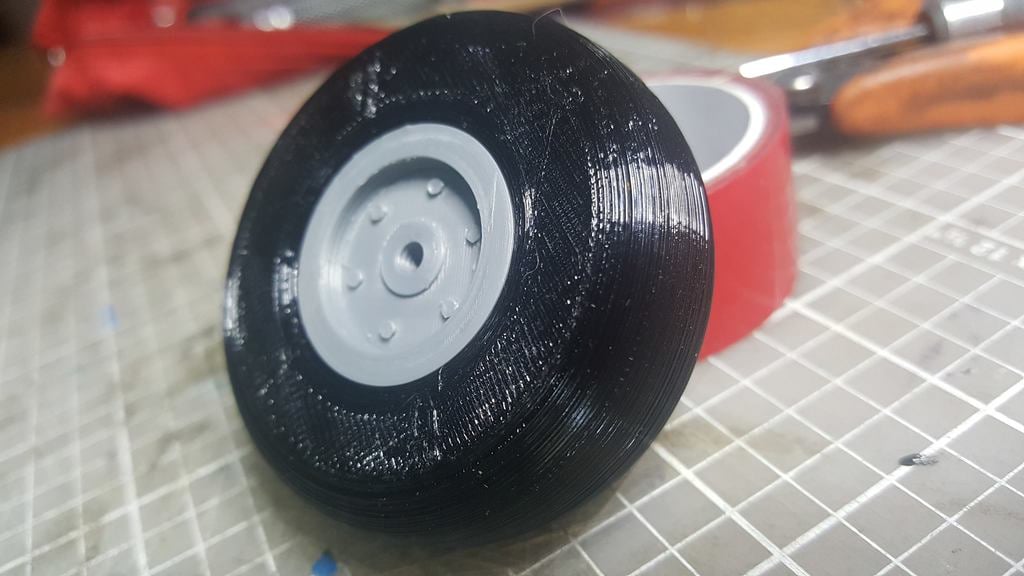 2 inch RC airplane wheel with a 3 mm center hole.