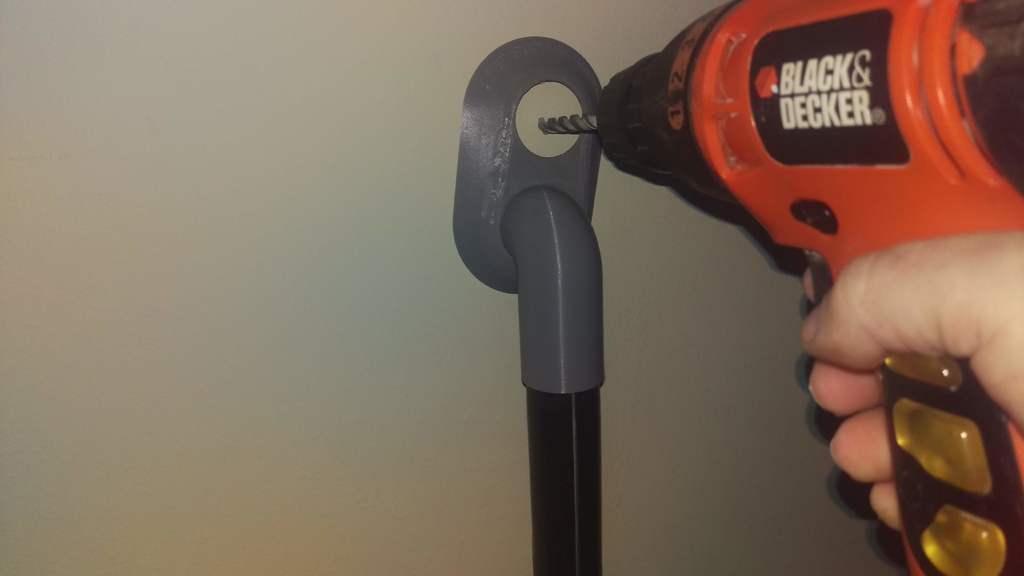 Self adhering drill vacuum