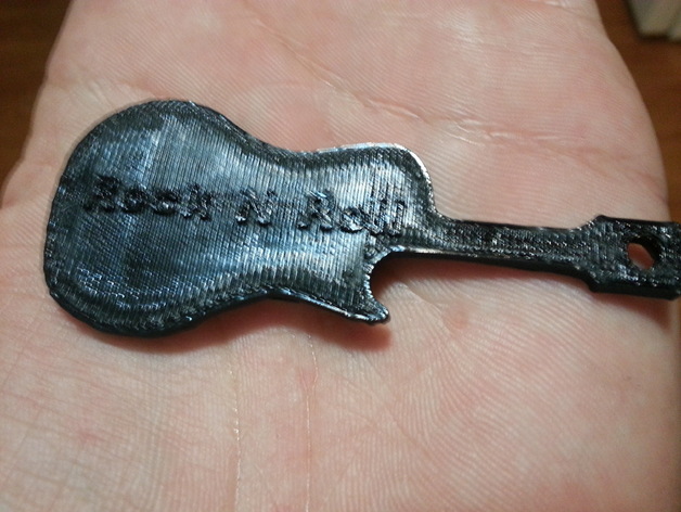 Guitar keychain, says ROCK N ROLL