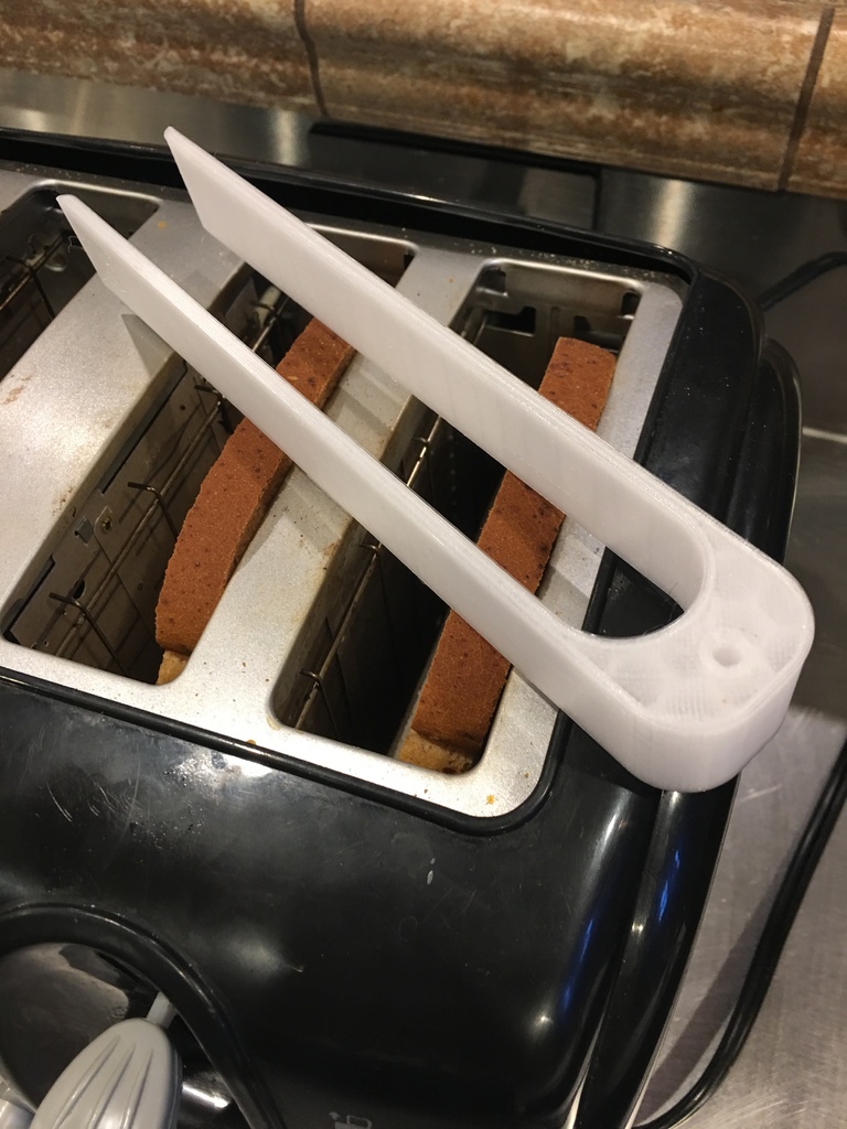 Tongs for bread removal from a Hot Toaster.