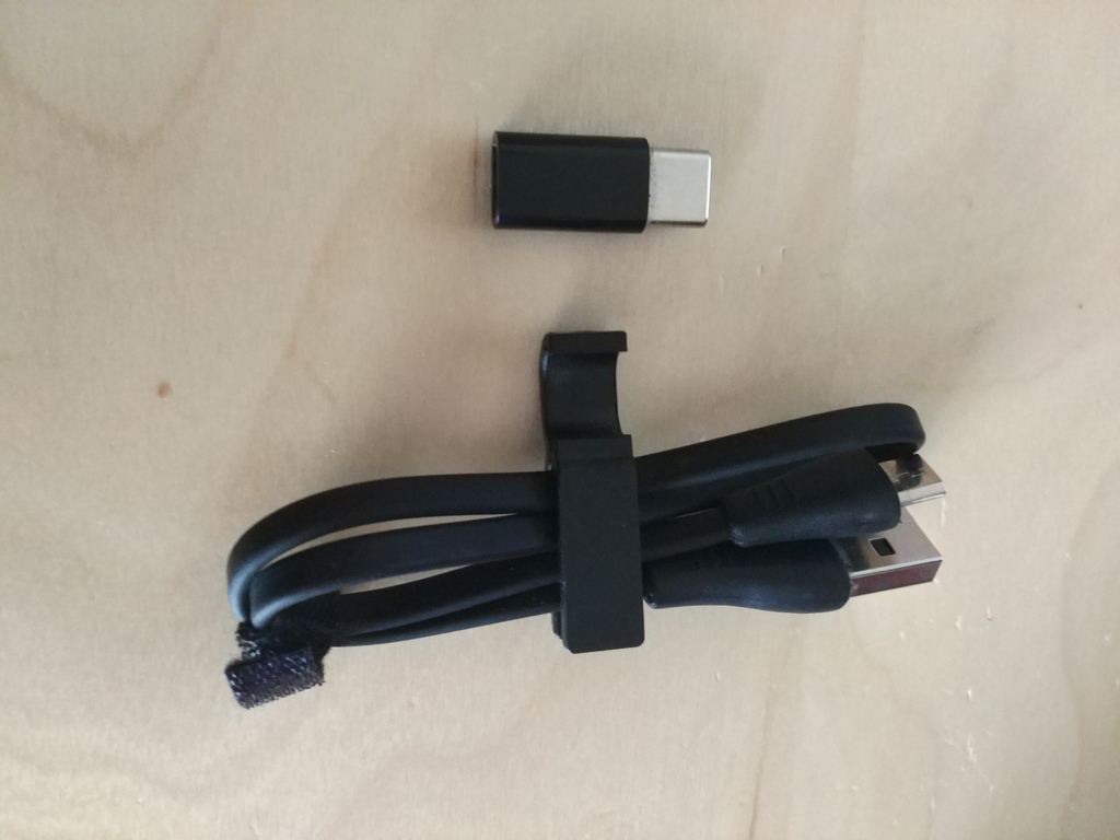 Usb cable clip and adaptor holder
