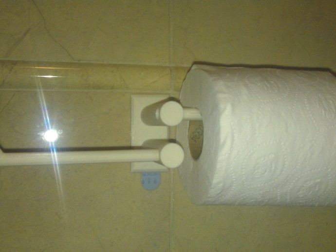 Toilet paper holder which can stick on the wall by 3M wall sticker.