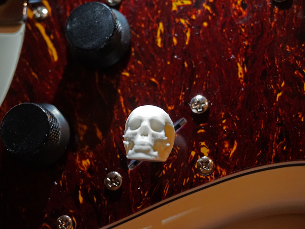 Electric guitar skull tone switch