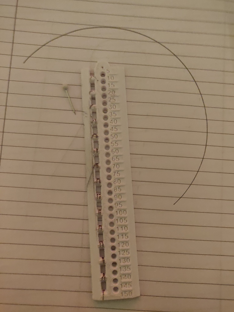 Ruler with compass holes