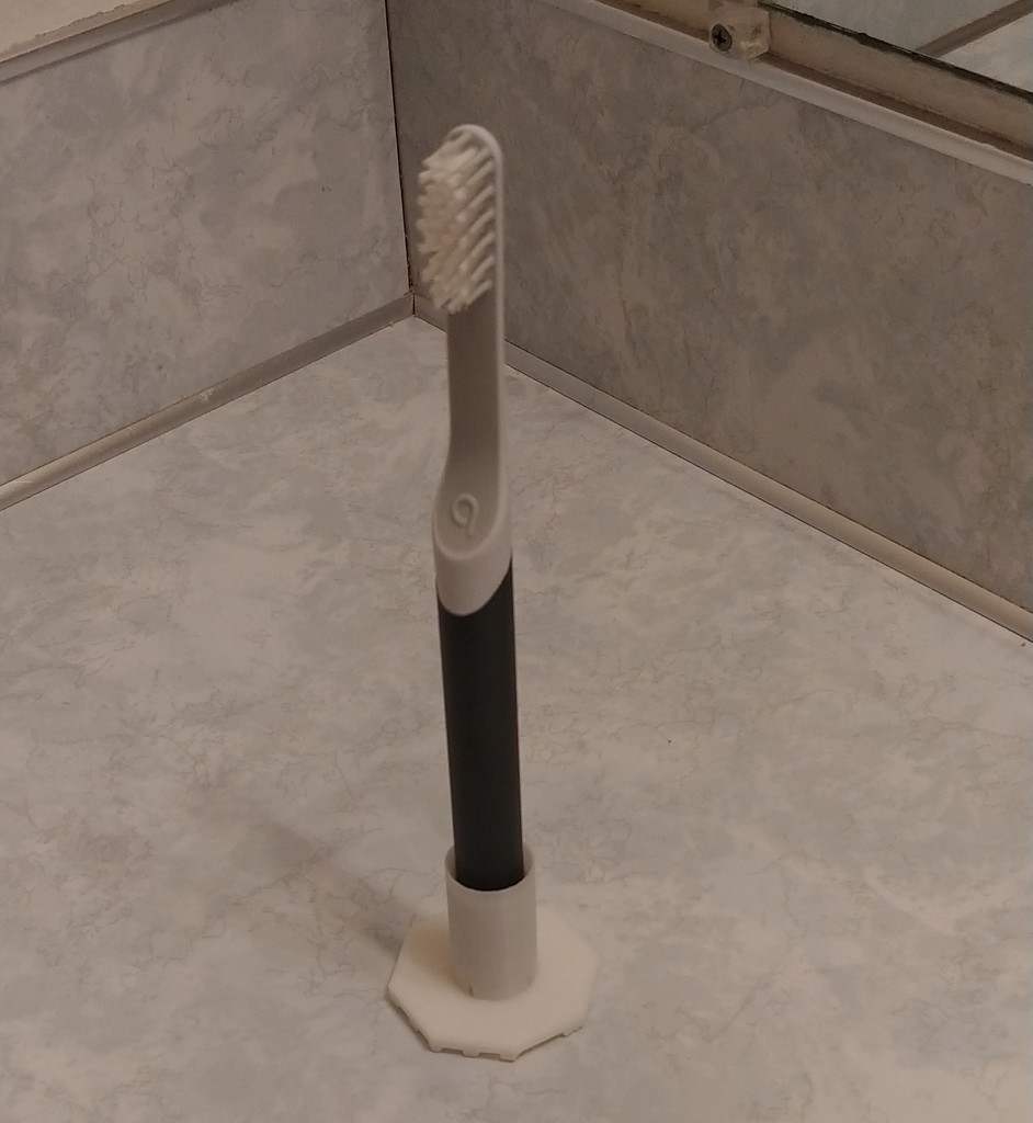 Quip toothbrush holder