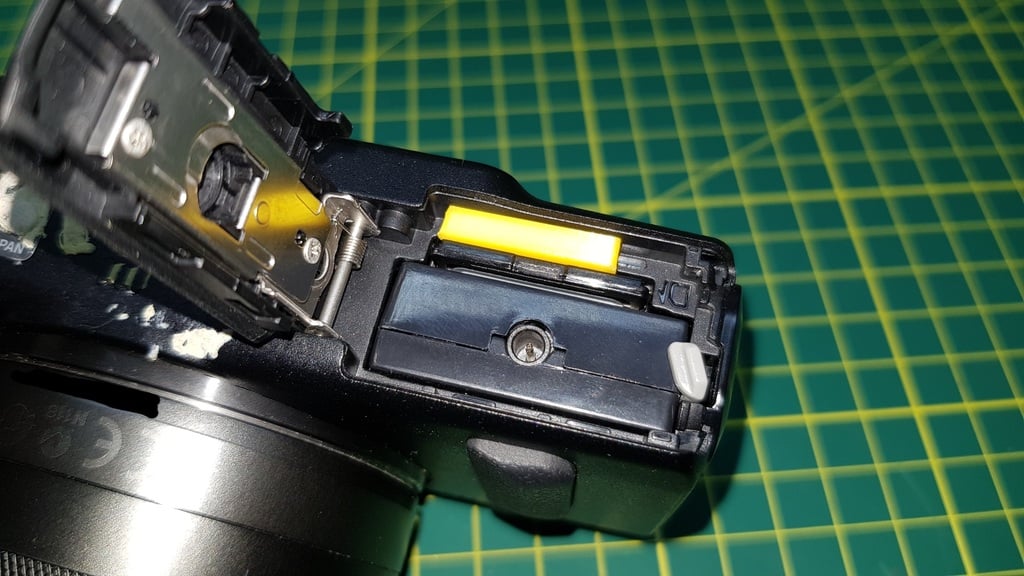 Canon EOS-m Battery switch defeat