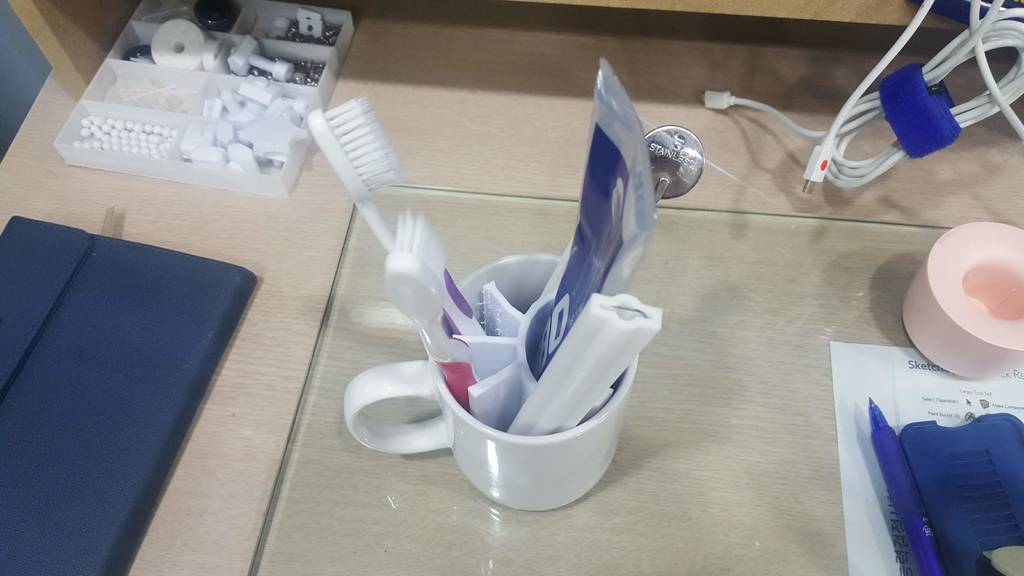 Toothbrush and toothpaste holder in cup
