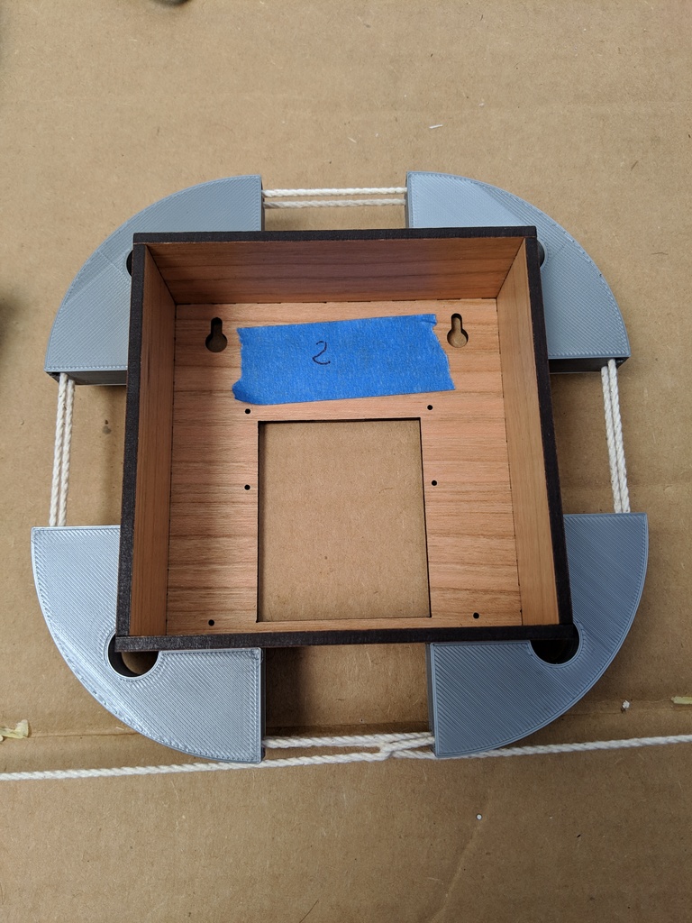 Adjustable corner box clamps