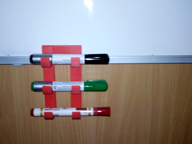 Uchwyt magnetyczny na mazaki do tablicy . Magnetic holder for markers for the whiteboard.