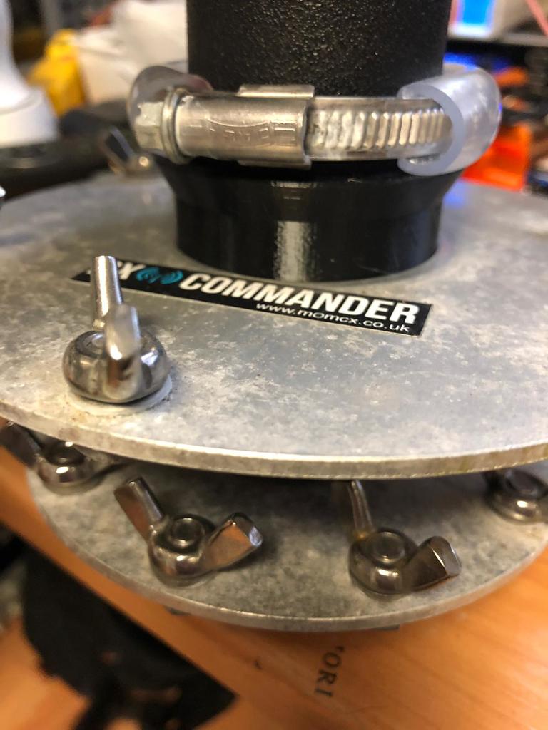 DX-Commander antenna driven plate hose clamp spacer.