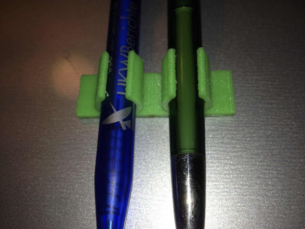 Stick-on pen holder