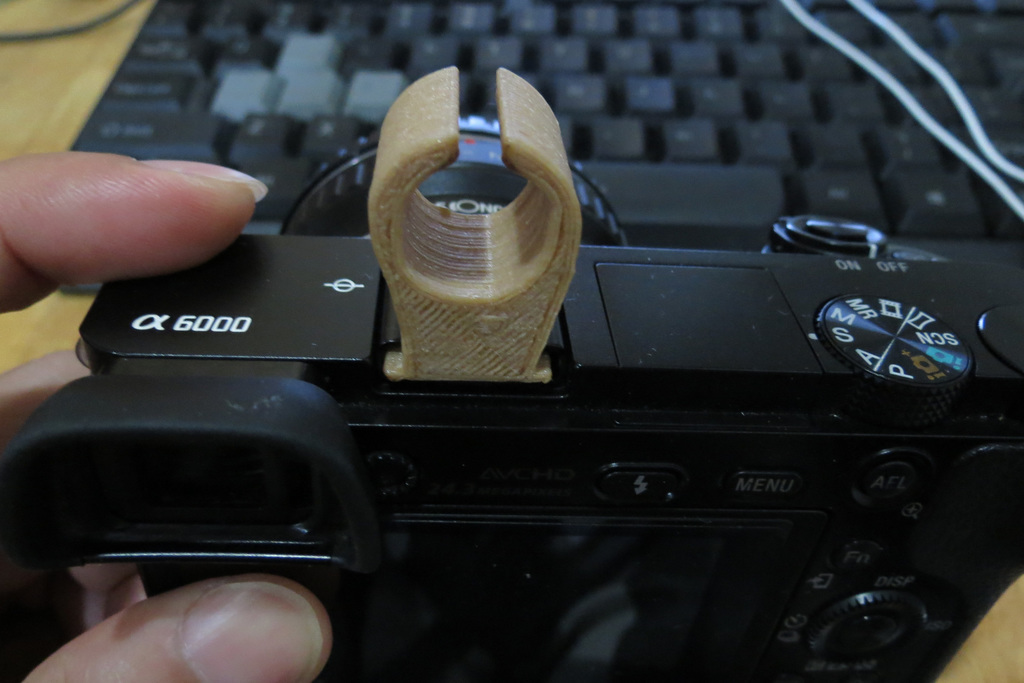 Camera hotshoe mic holder