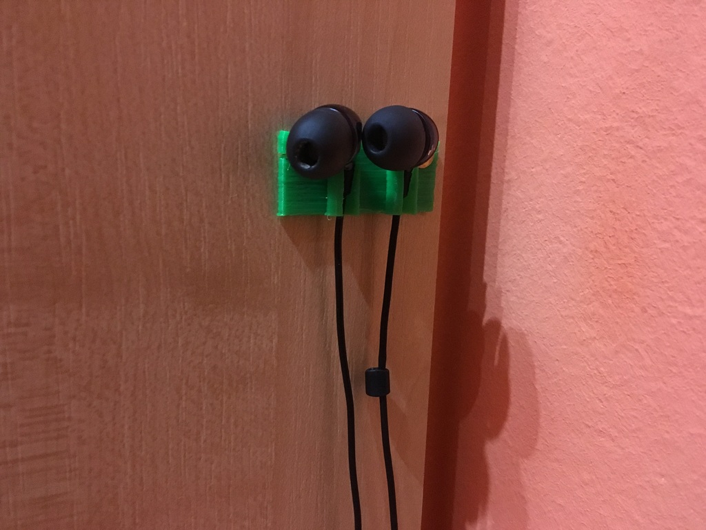 Wall earbuds holder.