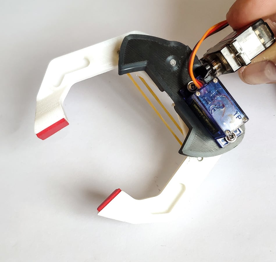 Robotic Gripper / Clamp. Two Degrees of freedom.  Servo controlled